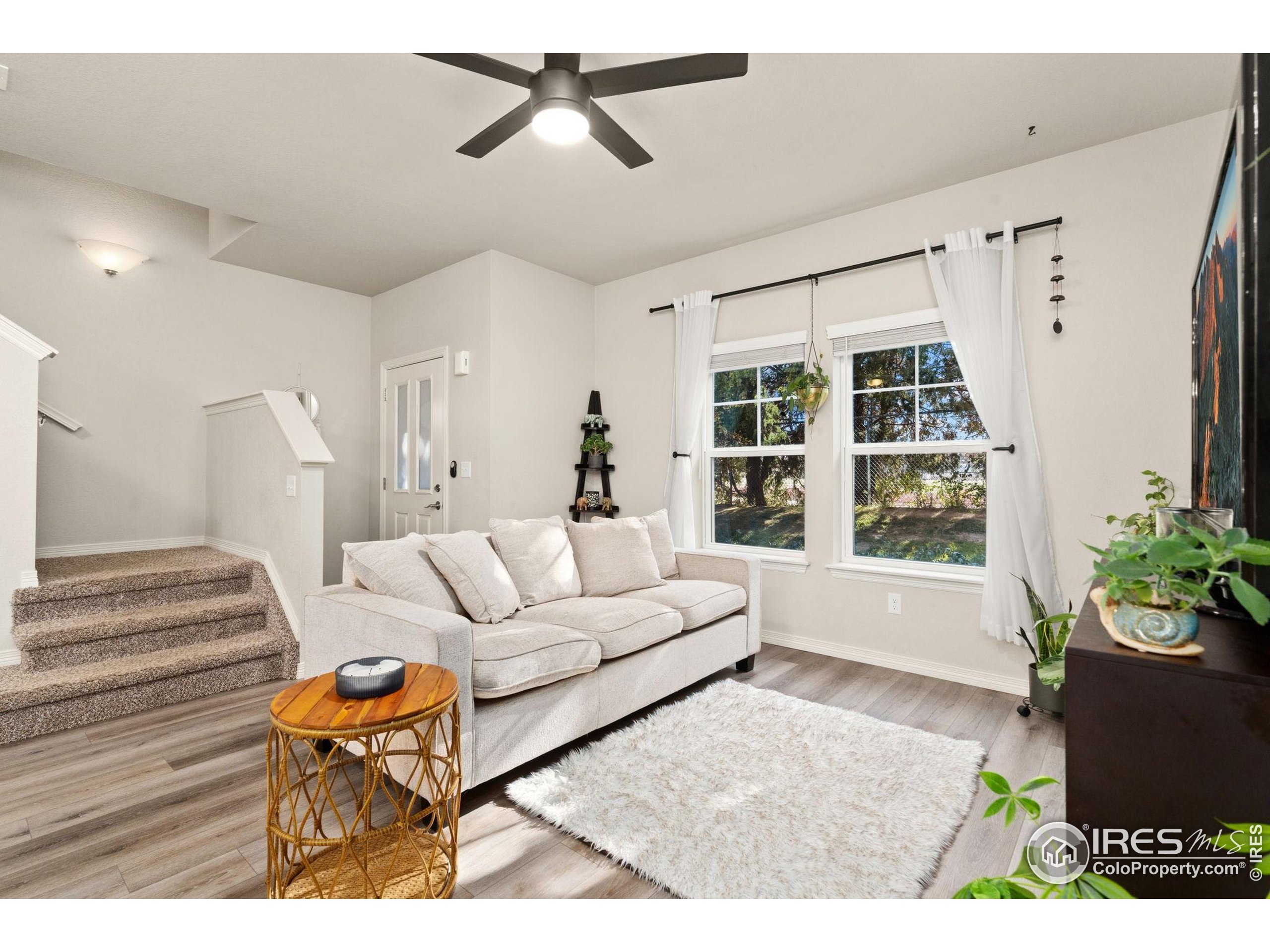 865 Winding Brook Drive Berthoud, CO 80513 - Photo 2 of 27 a living room with furniture and a window