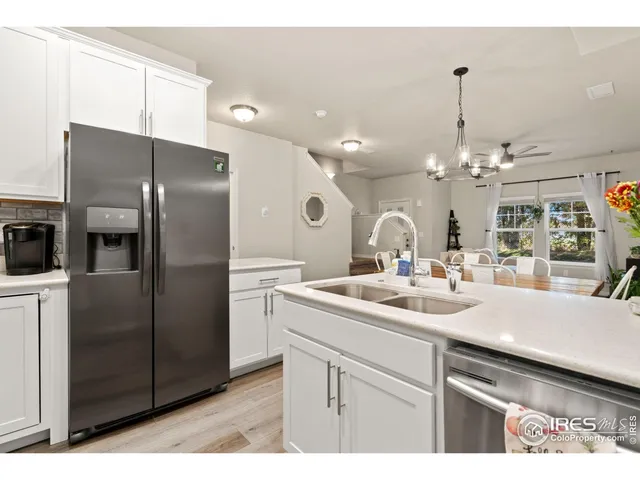 a kitchen with a sink and refrigerator