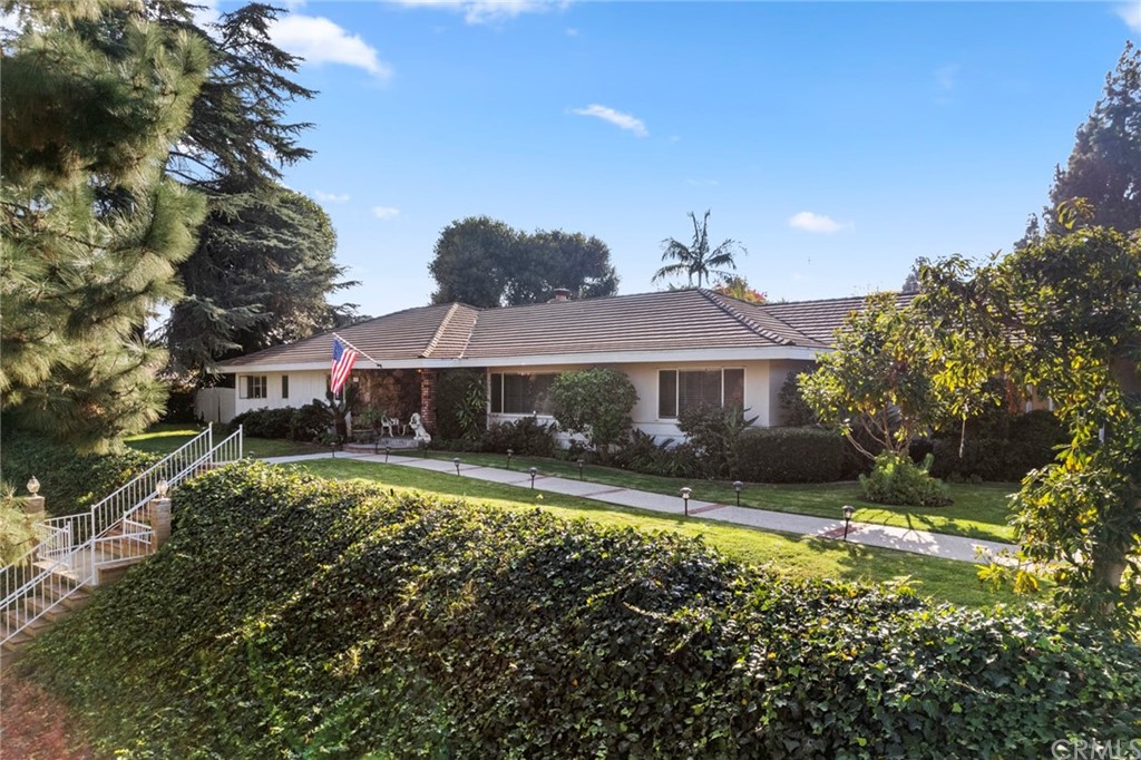 610 Laguna Road Fullerton, CA 92835 - Photo 2 of 29 a front view of a house with a yard