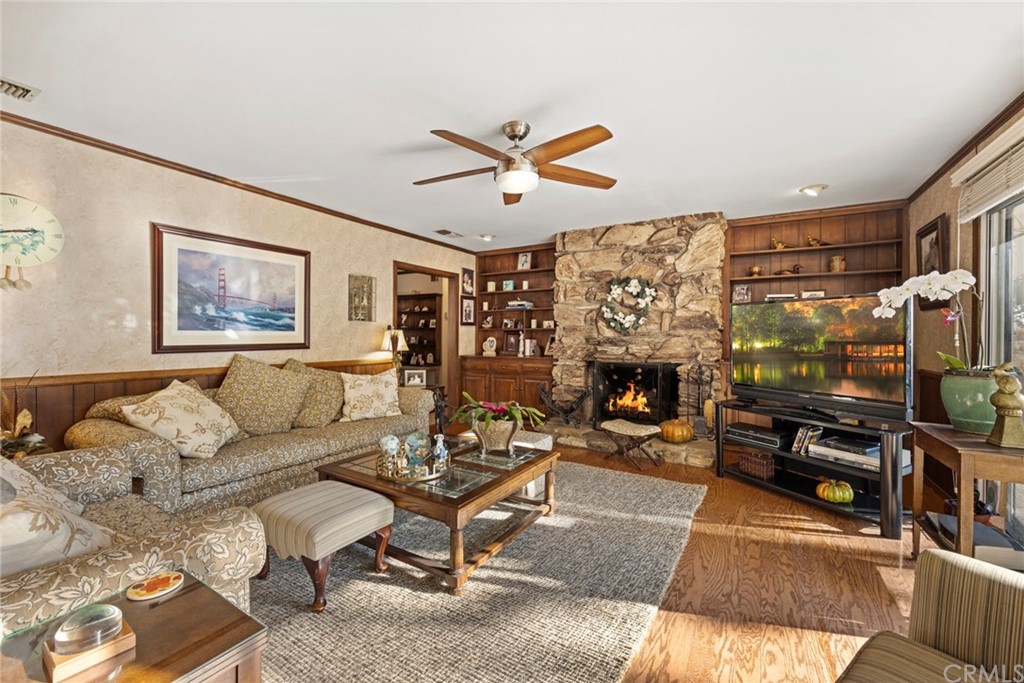 610 Laguna Road Fullerton, CA 92835 - Photo 13 of 29 a living room with furniture a flat screen tv and a fireplace