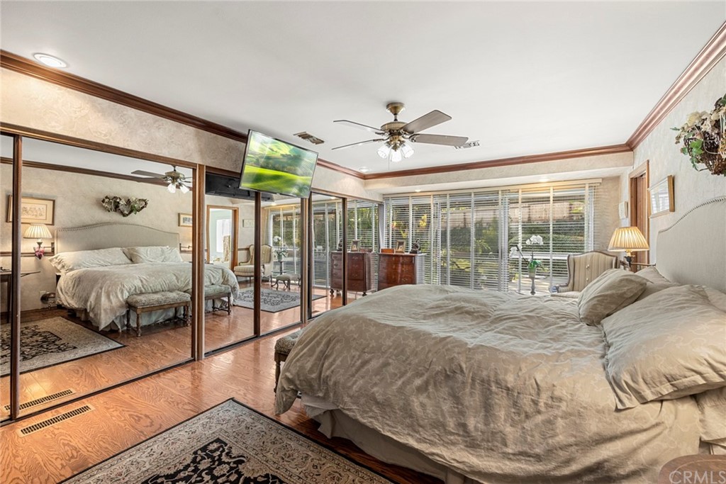 610 Laguna Road Fullerton, CA 92835 - Photo 15 of 29 a bedroom with a large bed and a chandelier