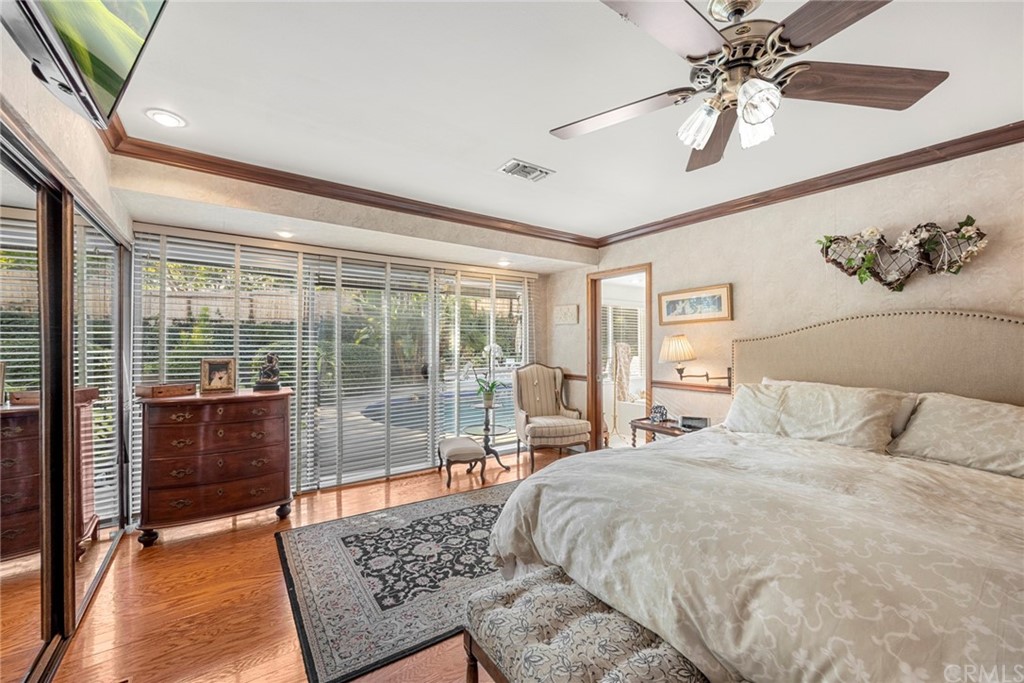 610 Laguna Road Fullerton, CA 92835 - Photo 16 of 29 a spacious bedroom with a large bed and a chandelier