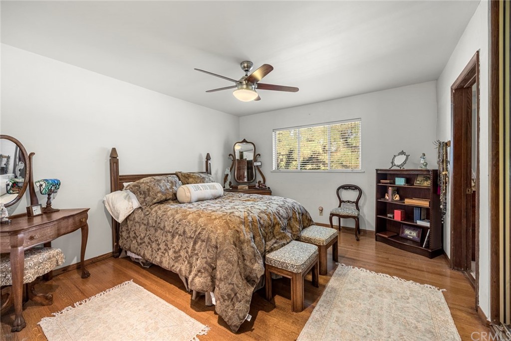 610 Laguna Road Fullerton, CA 92835 - Photo 19 of 29 a bedroom with bed and a chandelier