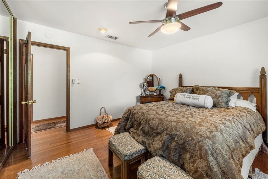 610 Laguna Road Fullerton, CA 92835 - Photo 21 of 29 a bedroom with bed and wooden floor