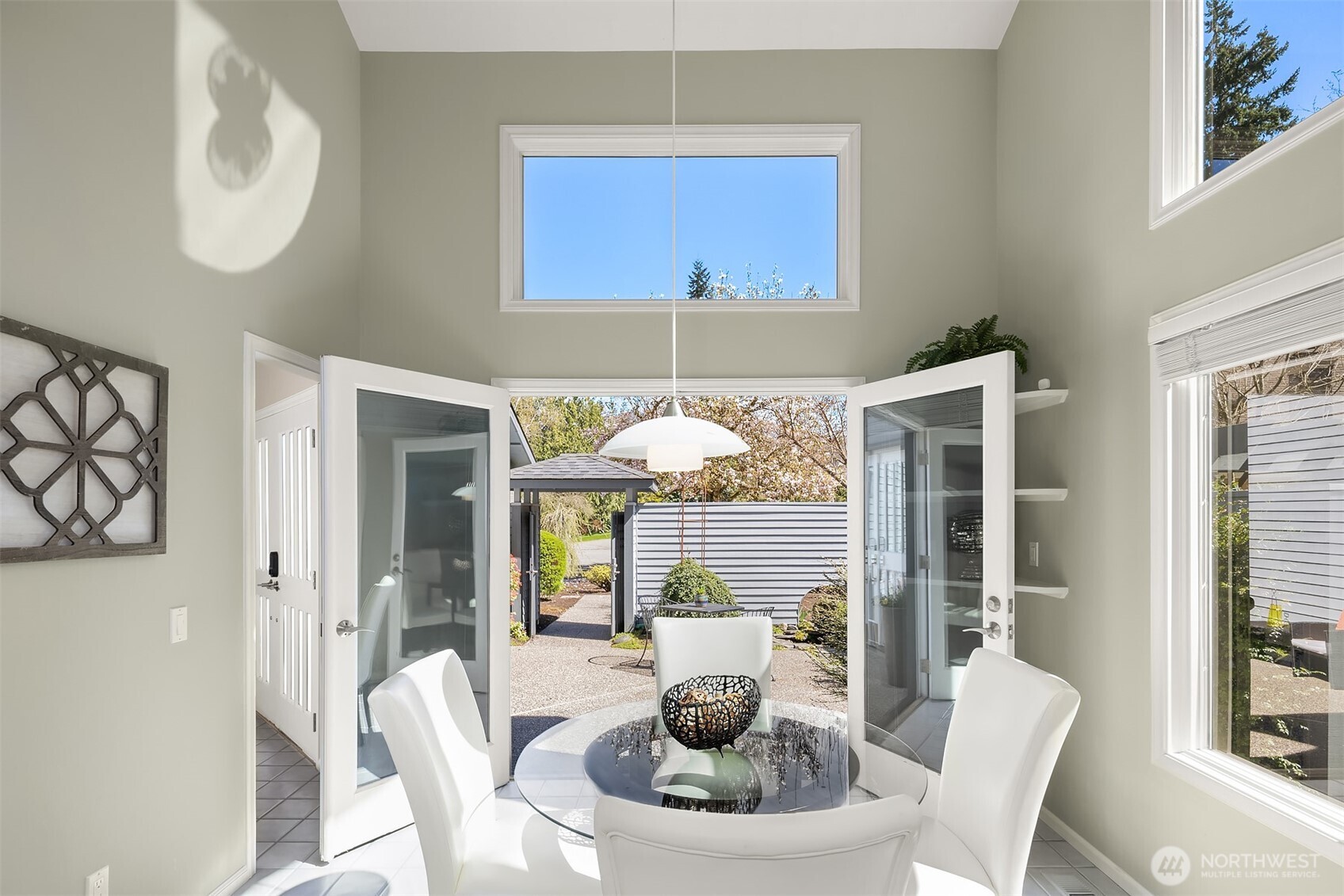 16309 110th Avenue Northeast Bothell, WA 98011 - Photo 18 of 38 a dining room with furniture a potted plant and a painting