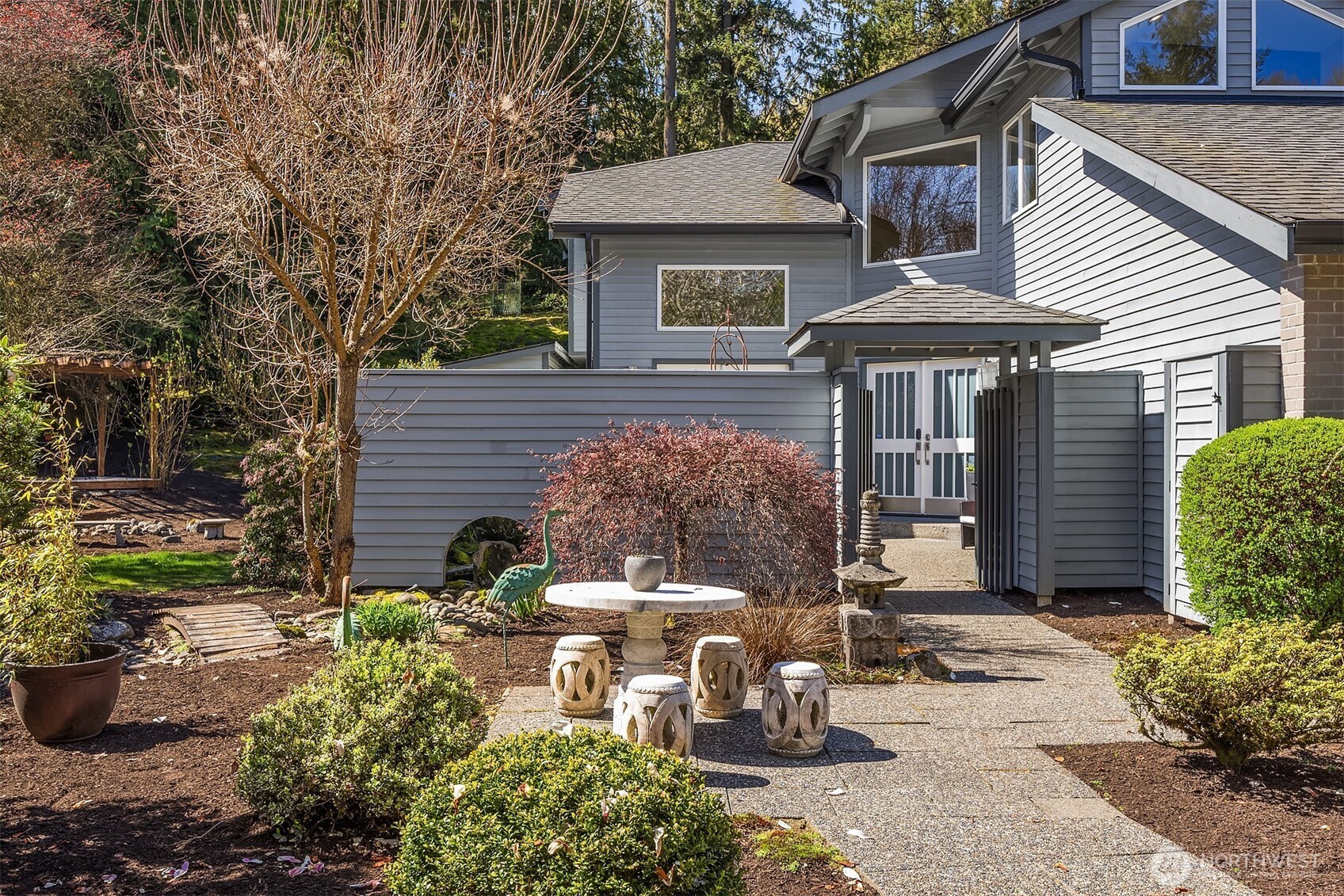 16309 110th Avenue Northeast Bothell, WA 98011 - Photo 2 of 38 a view of a patio with table and chairs and potted plants