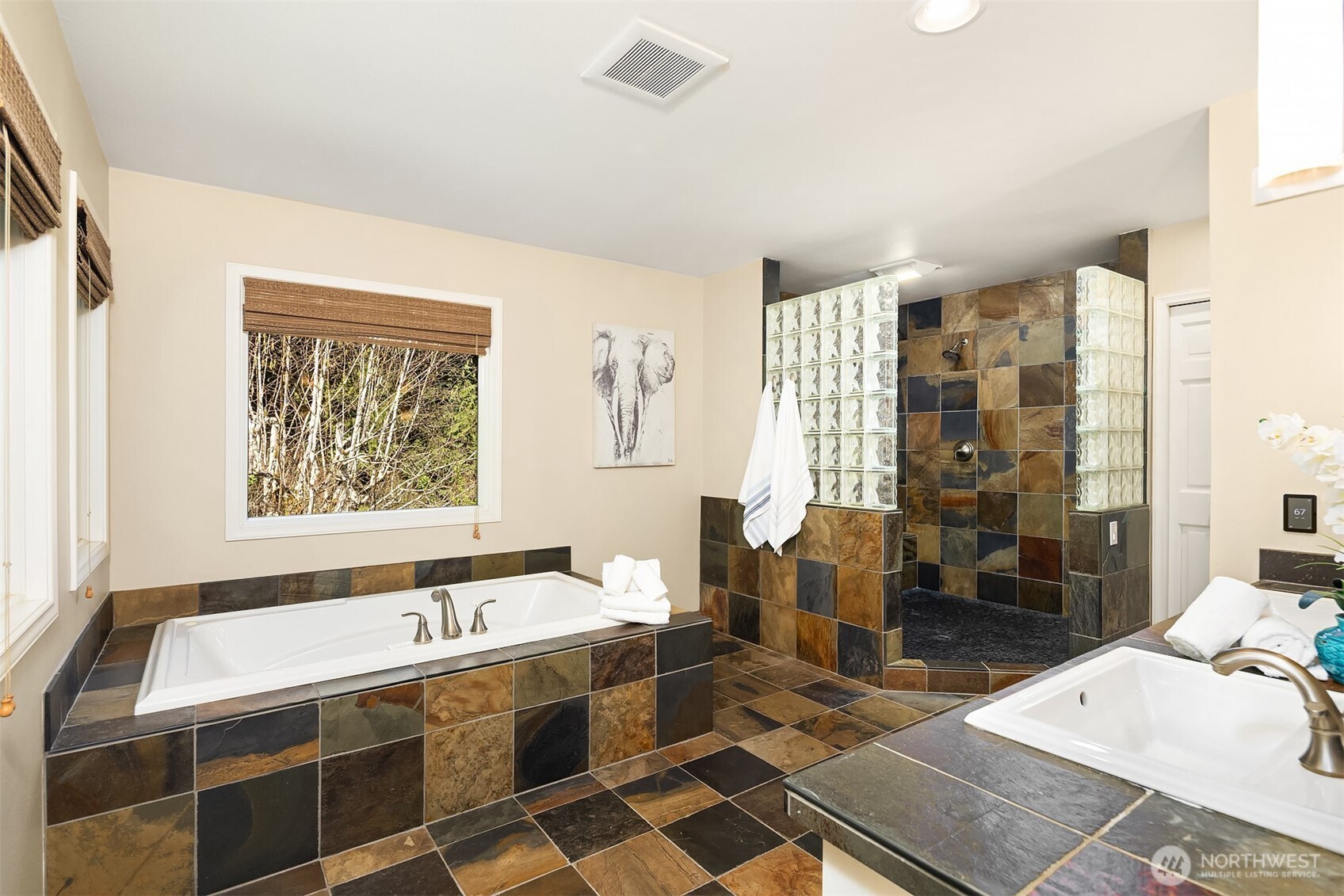 16309 110th Avenue Northeast Bothell, WA 98011 - Photo 23 of 38 a bathroom with a tub sink and mirror