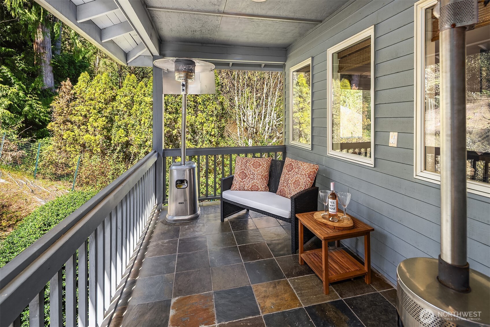 16309 110th Avenue Northeast Bothell, WA 98011 - Photo 24 of 38 a balcony with wooden floor and outdoor seating