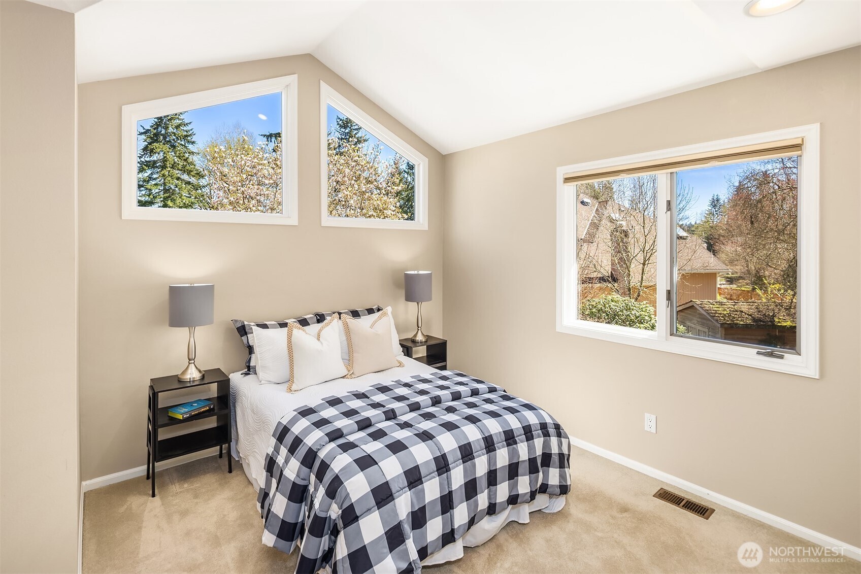 16309 110th Avenue Northeast Bothell, WA 98011 - Photo 26 of 38 a bedroom with a bed and a painting on the wall
