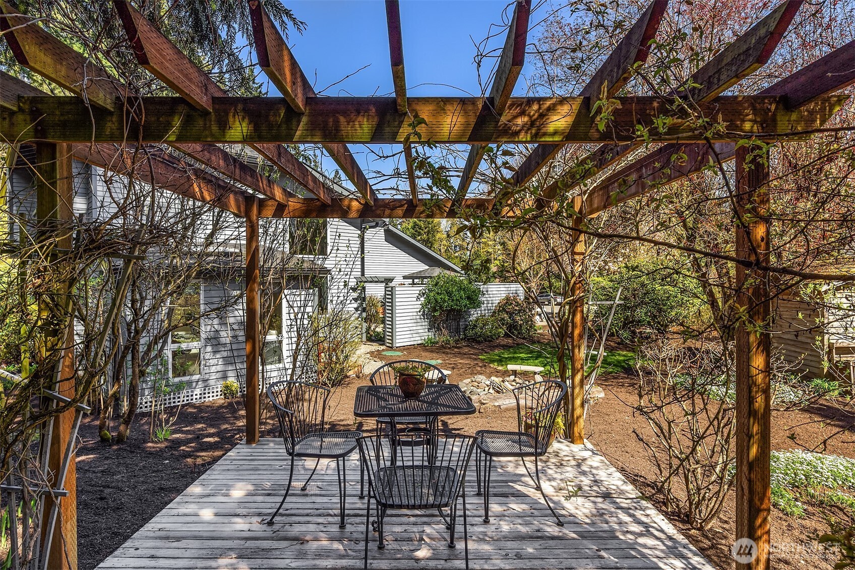 16309 110th Avenue Northeast Bothell, WA 98011 - Photo 34 of 38 a patio with glass top table and chairs