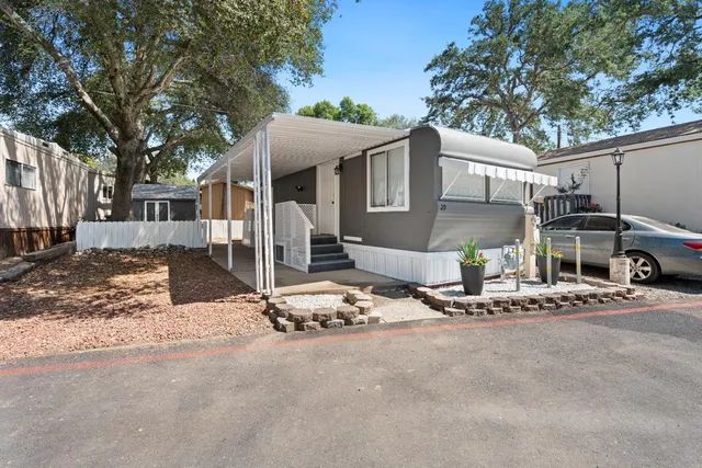 a view of a house with snow on the road