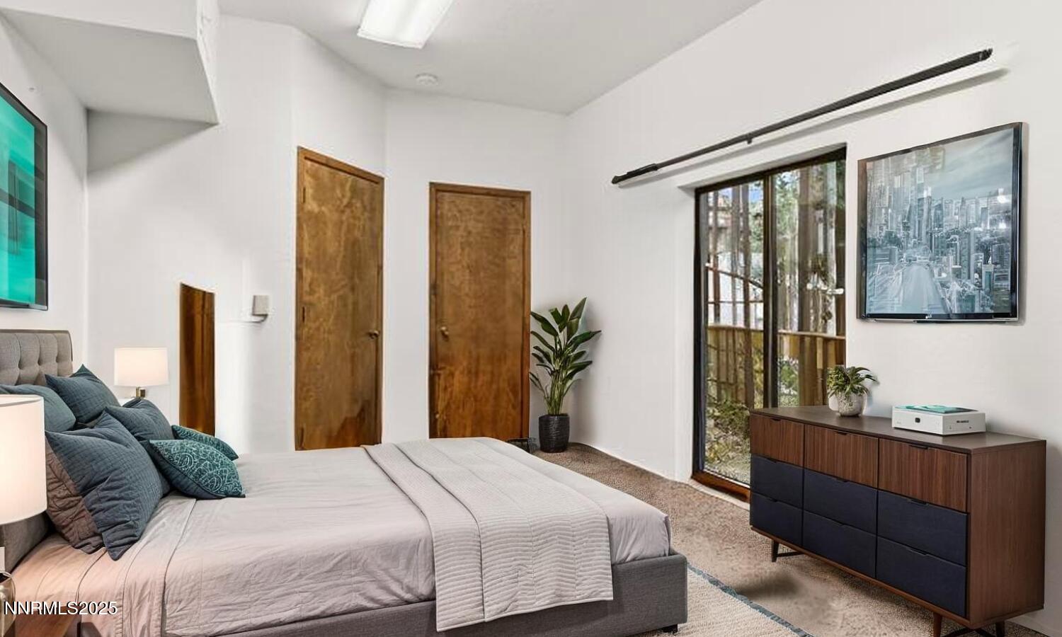 178 Tahoma Circle, Unit B Stateline, NV 89449 - Photo 21 of 52 a bedroom with a large bed and a window