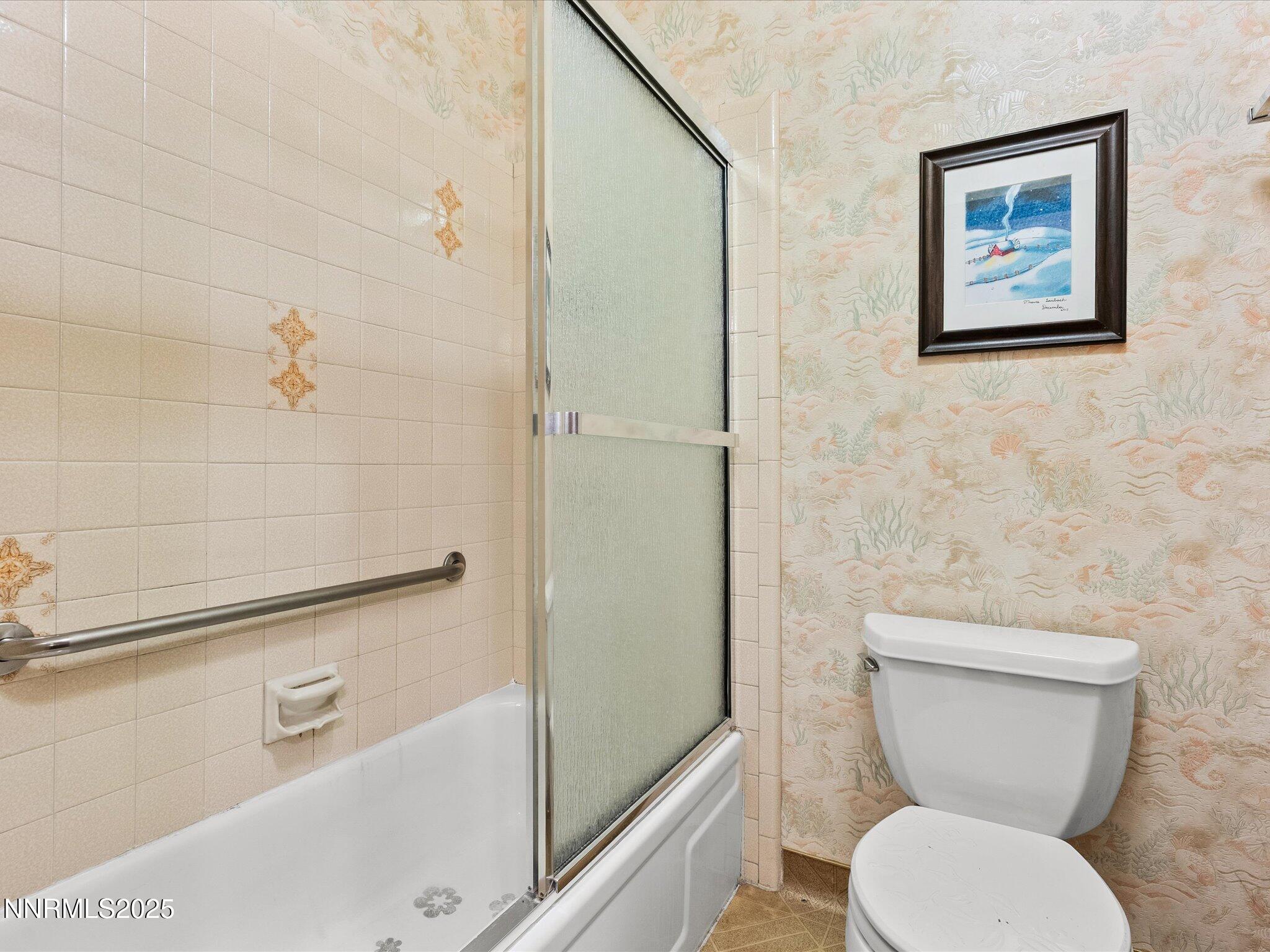 178 Tahoma Circle, Unit B Stateline, NV 89449 - Photo 26 of 52 a white toilet sitting next to a bath tub