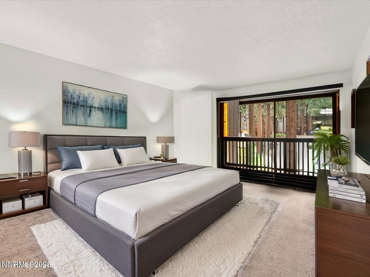 178 Tahoma Circle, Unit B Stateline, NV 89449 - Photo 27 of 52 a bedroom with a bed and a large window