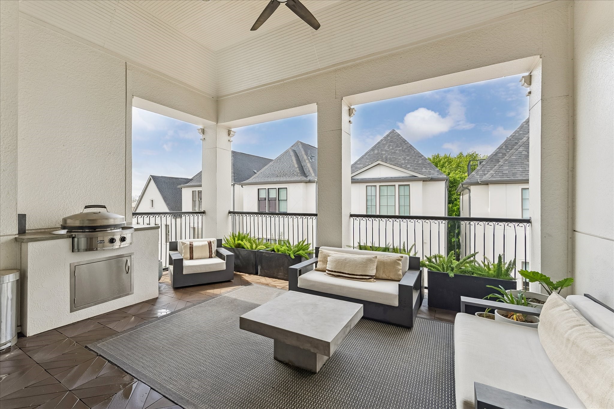 6108 Nicholas Grove Place Houston, TX 77055 - Photo 22 of 29 The covered roof deck serves as an exceptional outdoor retreat, featuring a built-in EVO gas grill and ample space for elevated entertaining with skyline views and fresh air.