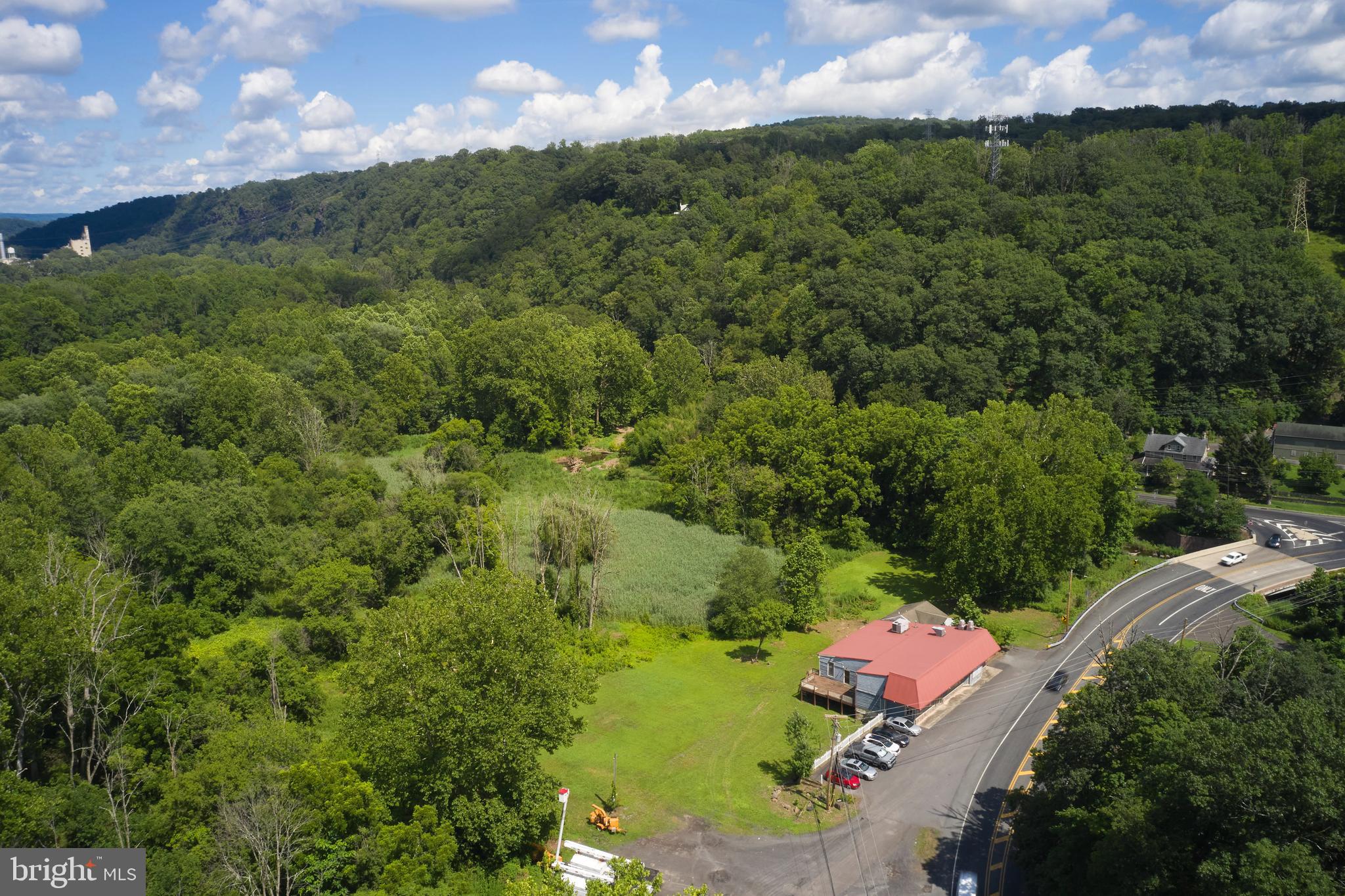 9755 Easton Road Upper Black Eddy, PA 18972 - Photo 8 of 11 a view of a street with a yard