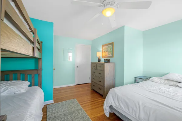 a bathroom with a toilet a sink and a window