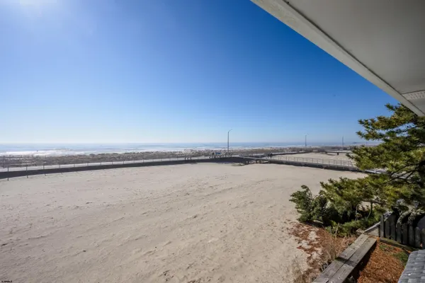 a view of balcony with wooden floor and outdoor seating