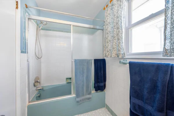 a backyard of a house with outdoor seating and stairs