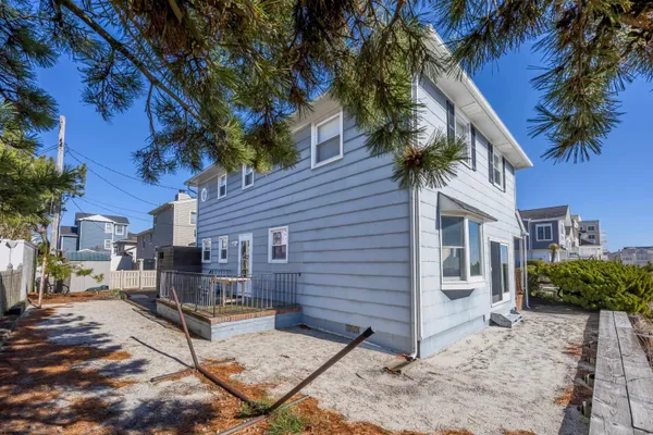 a bedroom with a bed and a lamp