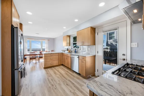 a view of a patio with a table and chairs
