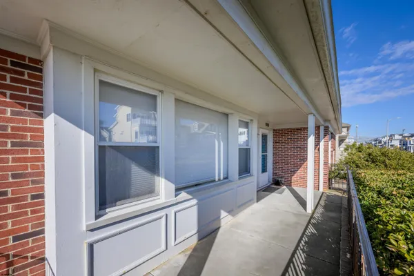 a large kitchen with stainless steel appliances granite countertop a refrigerator and a stove top oven