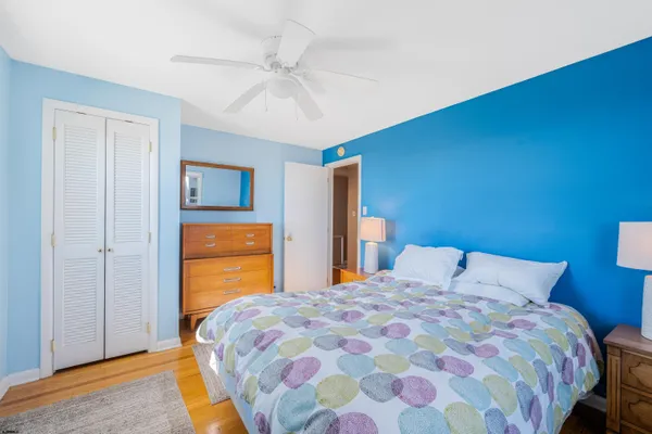 a balcony with furniture and a potted plant