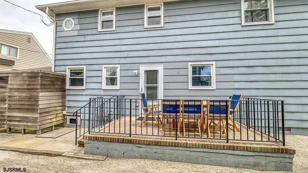 a view of a dining room with furniture and a table
