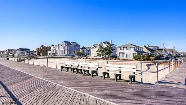 a bathroom with a sink toilet and a mirror