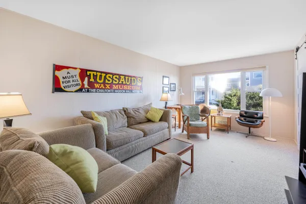 a bedroom with furniture and a lamp