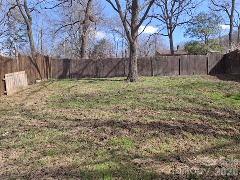 129 Harrison Street Swannanoa, NC 28778 - Photo 9 of 17 a view of backyard with wooden fence