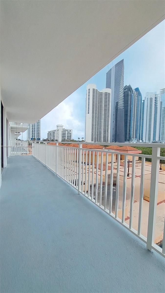 Sunny Isles Beach Sunny Isles Beach, FL 33160 - Photo 2 of 11 a view of a hallway with wooden floor