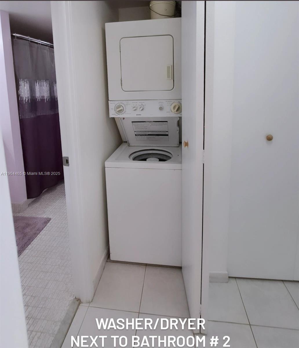 Sunny Isles Beach Sunny Isles Beach, FL 33160 - Photo 3 of 11 a utility room with dryer and washer