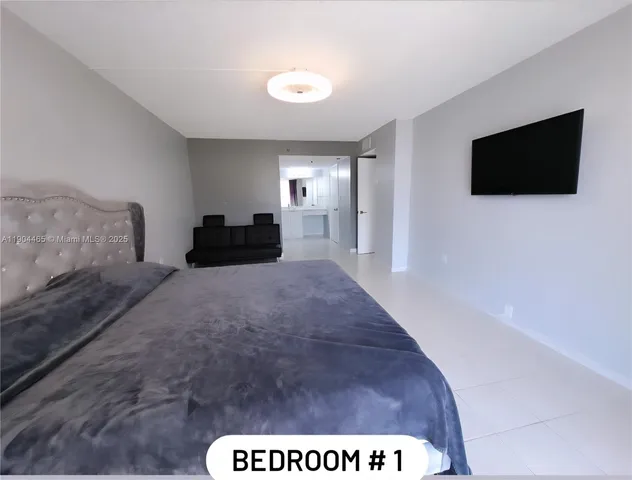 a living room with a couch and a flat screen tv