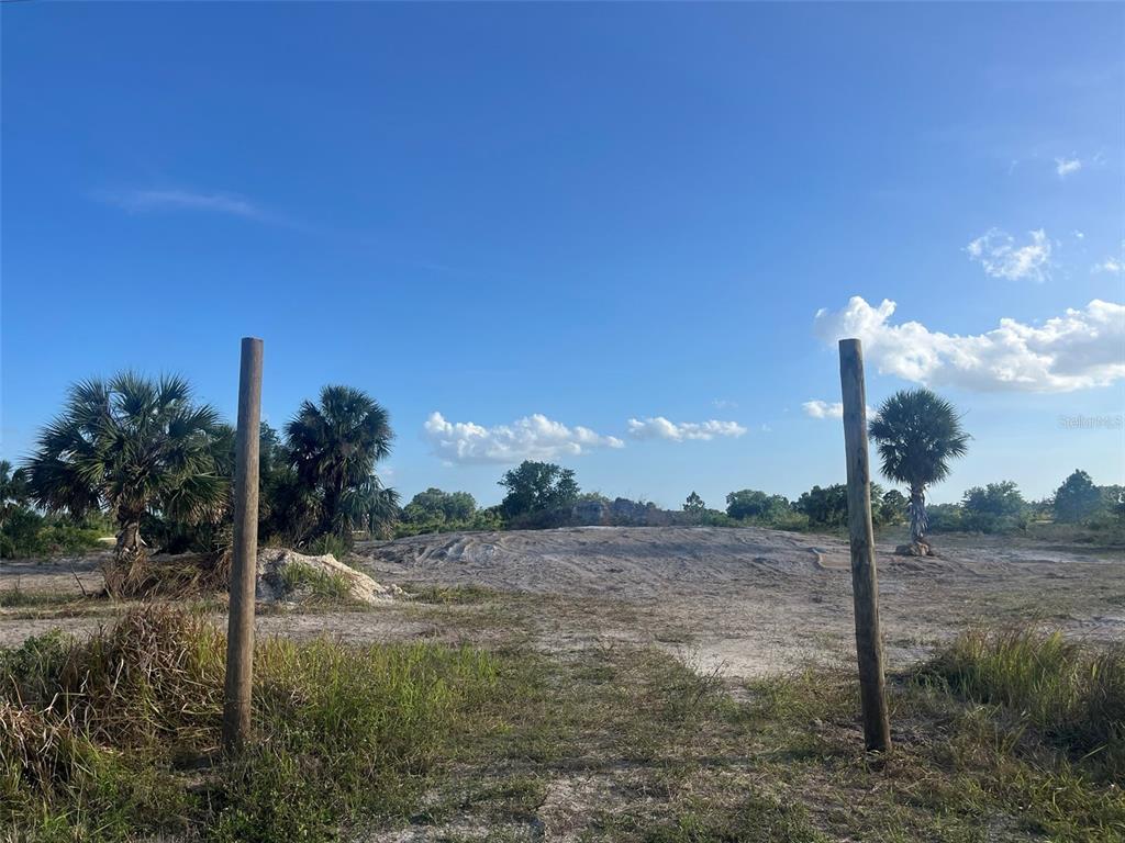 16058 290th Street Okeechobee, FL 34972 - Photo 1 of 16 a view of a lake from a yard