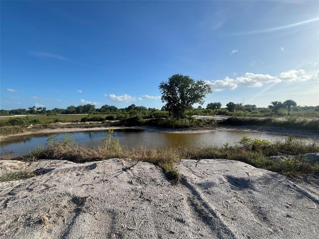 16058 290th Street Okeechobee, FL 34972 - Photo 4 of 16 a view of a lake with a city