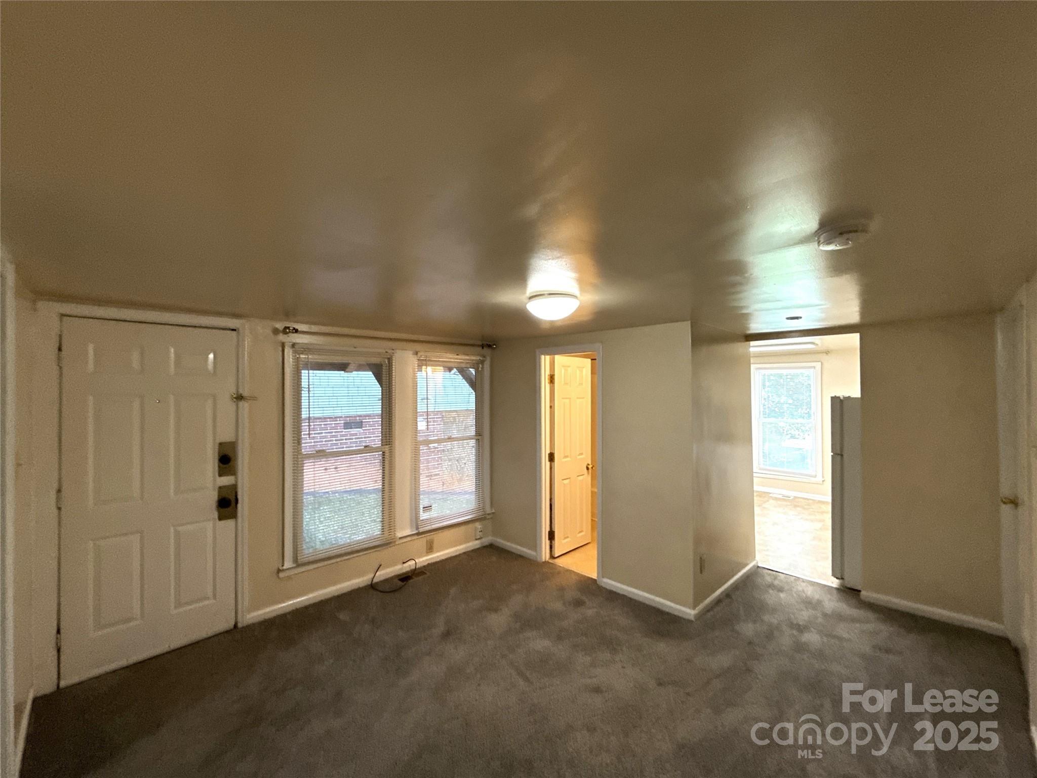 1433 Pecan Avenue, Unit C Charlotte, NC 28205 - Photo 2 of 10 an empty room with windows and closet
