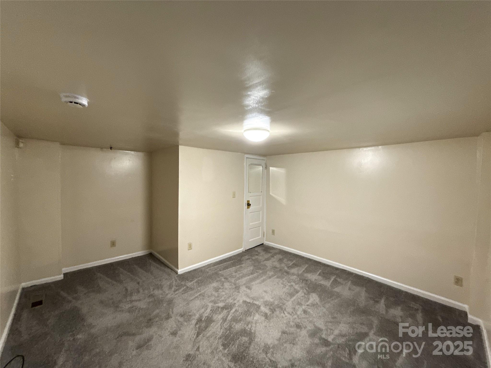 1433 Pecan Avenue, Unit C Charlotte, NC 28205 - Photo 7 of 10 an empty room with a empty space