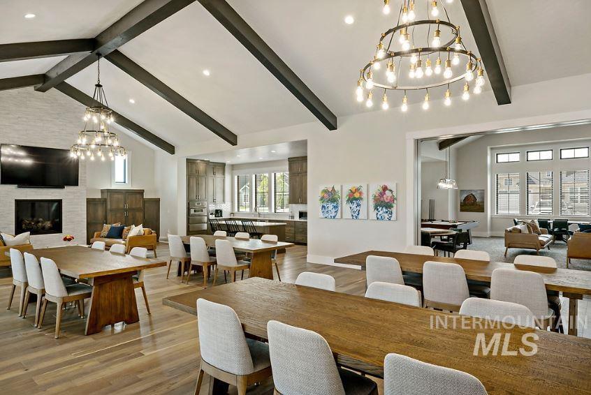 3480 East Macumbo Lane Meridian, ID 83642 - Photo 29 of 43 Dining area featuring a chandelier, beamed ceiling, healthy amount of natural light, wood finished floors, and high vaulted ceiling