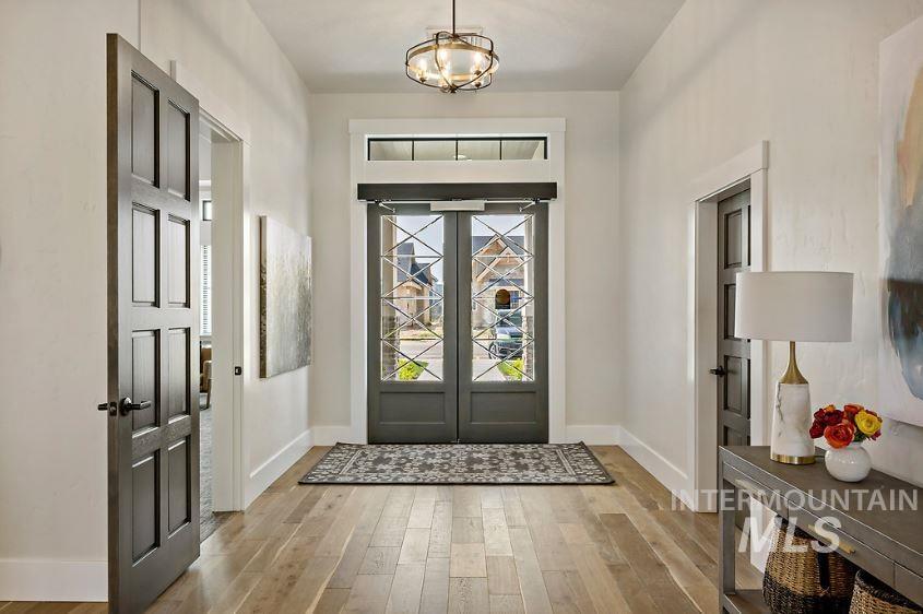 3480 East Macumbo Lane Meridian, ID 83642 - Photo 40 of 43 Doorway featuring wood finished floors and baseboards