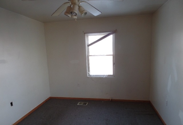 303 Louis Road Joliet, IL 60433 - Photo 8 of 14 an empty room with a window
