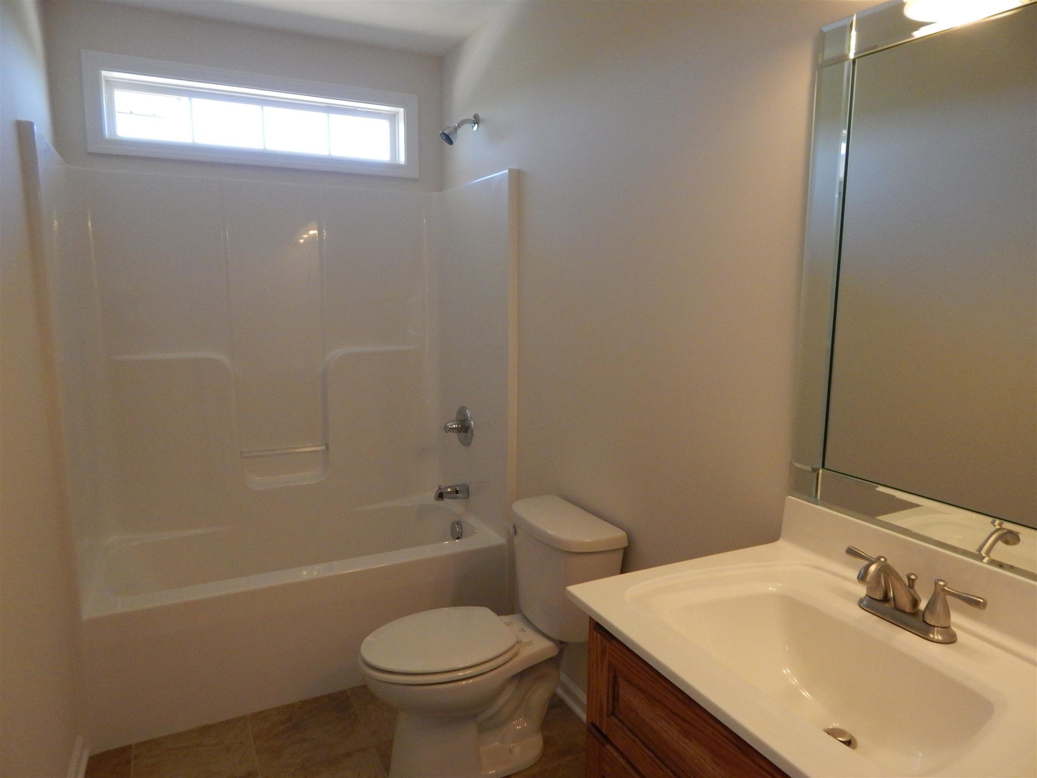 1545 Heller Ridge Spring Hill, TN 37174 - Photo 13 of 19 a bathroom with a sink toilet and shower