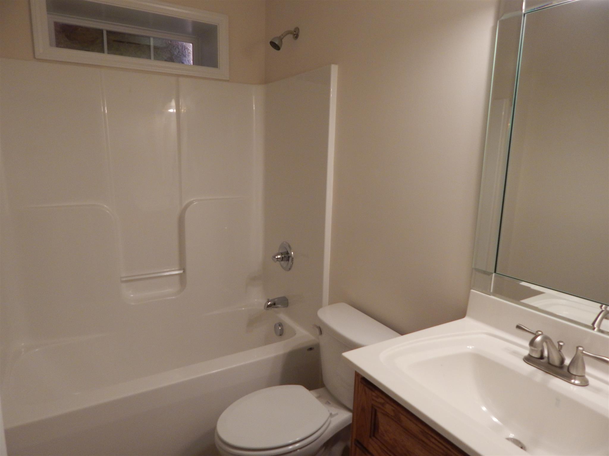 1545 Heller Ridge Spring Hill, TN 37174 - Photo 15 of 19 a bathroom with a sink toilet and shower