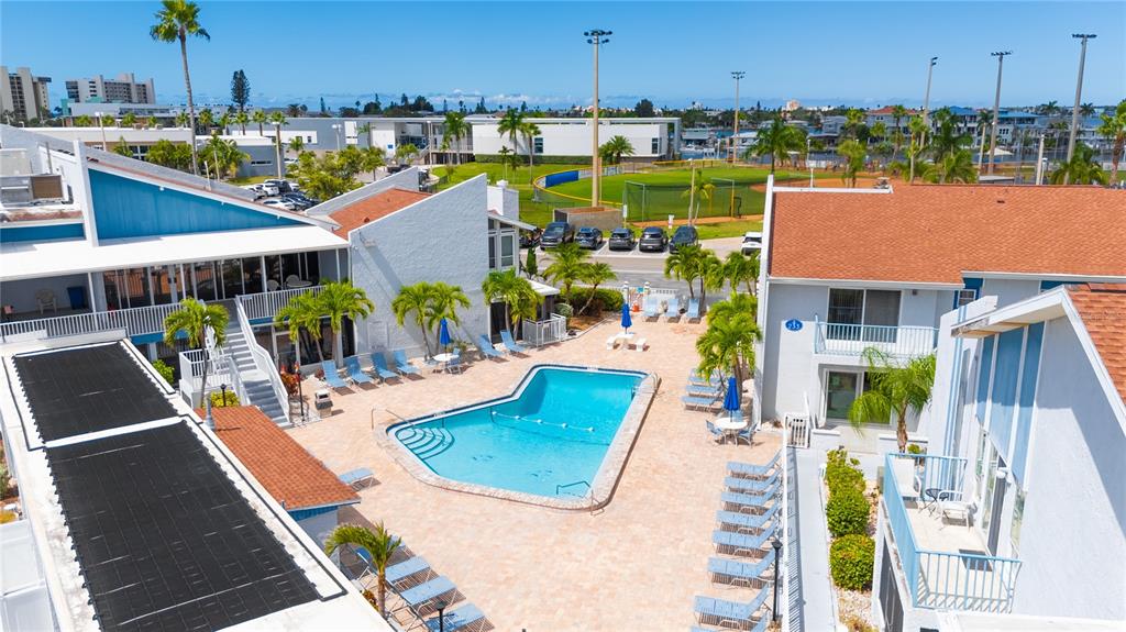 230 Medallion Boulevard, Unit E Madeira Beach, FL 33708 - Photo 34 of 35 an aerial view of a house with garden space and balcony