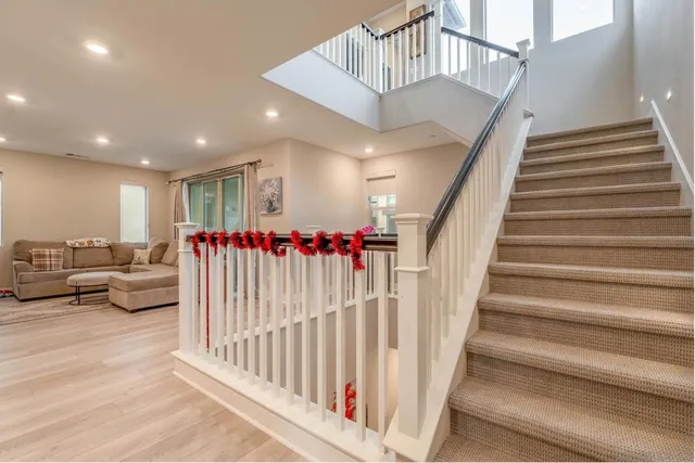 a living room with furniture and flowers