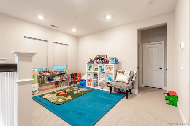 a living room with lots of furniture and a rug