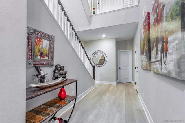 a view of entryway with wooden floor and stairs