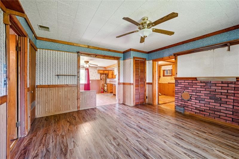 789 Mahoning Road Templeton, PA 16259 - Photo 15 of 41 a view of empty room with wooden floor and fan