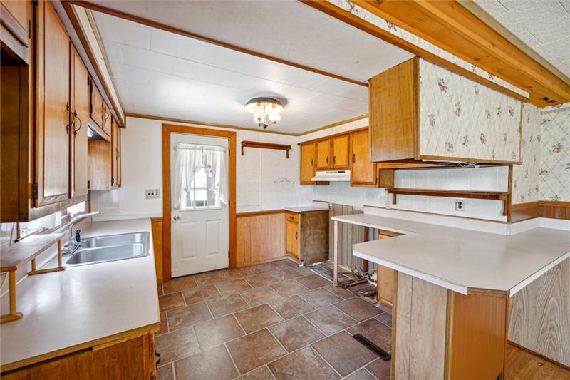 789 Mahoning Road Templeton, PA 16259 - Photo 19 of 41 a kitchen with a refrigerator and a sink