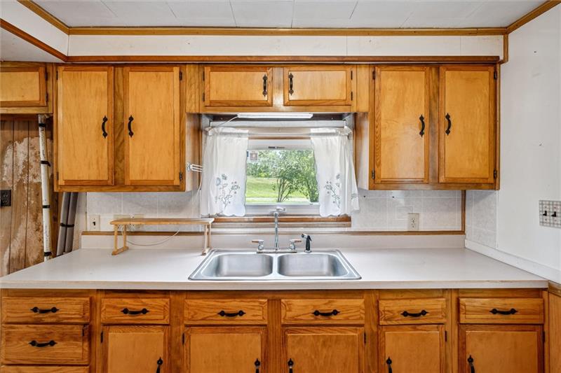 789 Mahoning Road Templeton, PA 16259 - Photo 21 of 41 a kitchen with stainless steel appliances granite countertop a sink and a wooden cabinets
